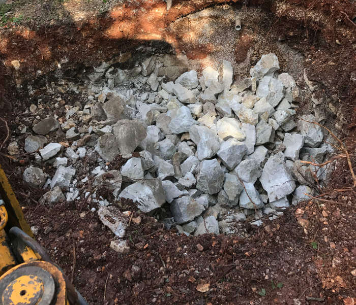 rock breaking with backhoe for larger hole to install new septic tank 1-2-2017