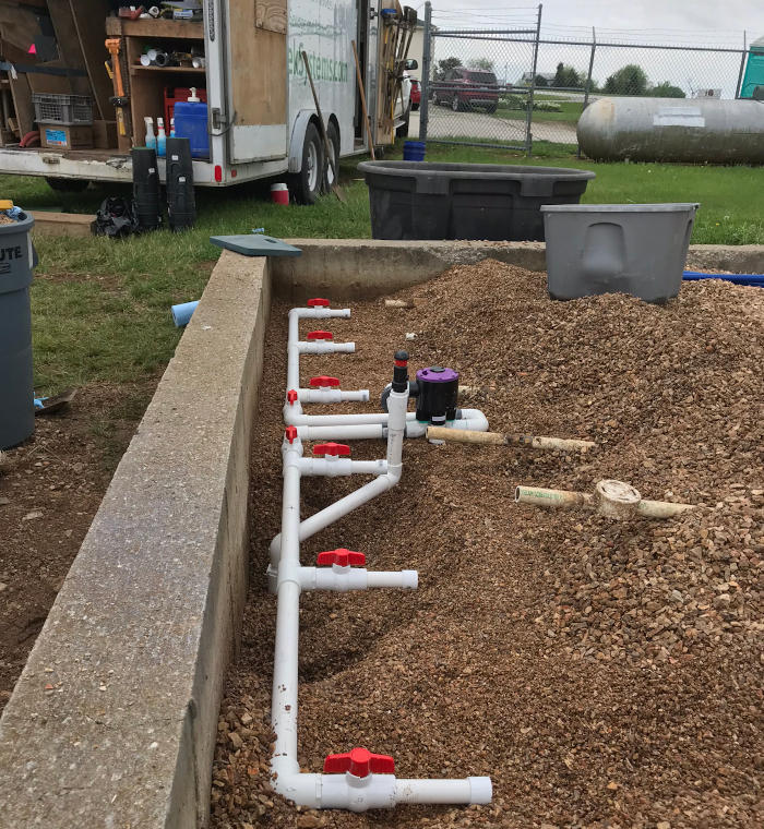repairing distribution pipes on sewage treatment plant in Missouri